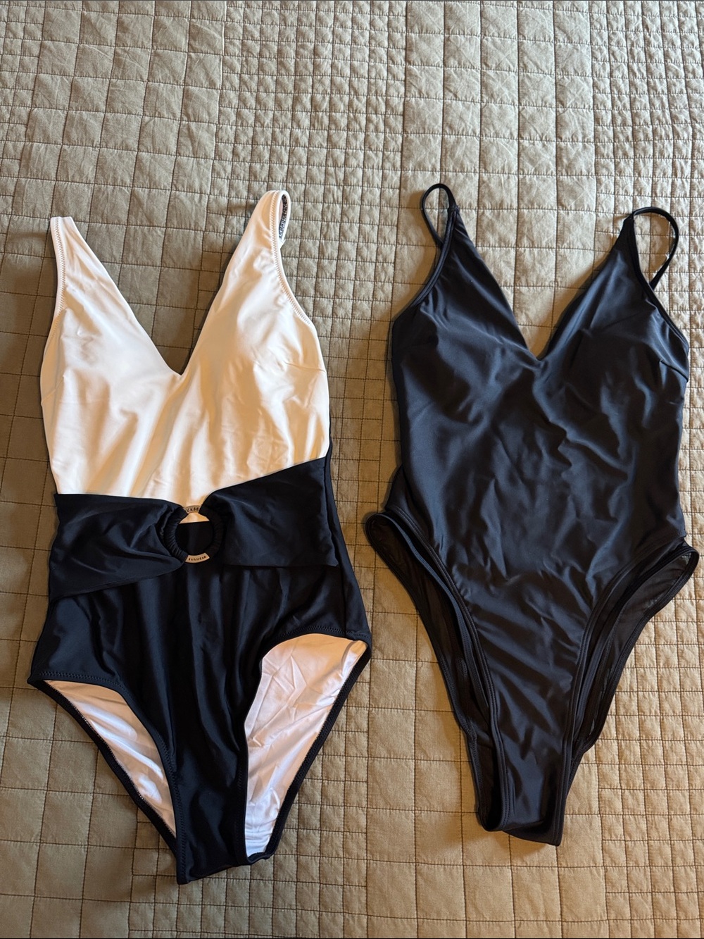 Two Black and White One-Piece Swimsuits